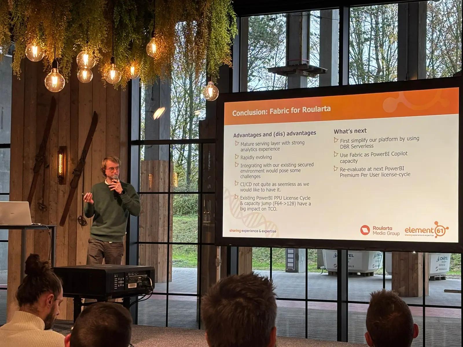 A speaker presenting a case study in the main session room